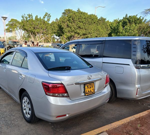Two packed airport transfer vehicles ready for passenger pickup from Karen to JKIA Airport
