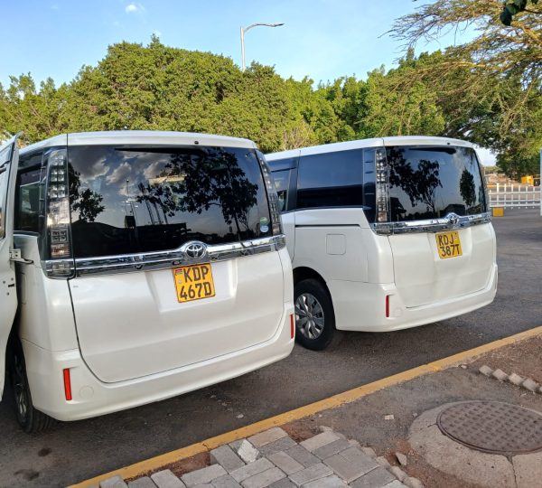 Nairobi airport transfer vans parked at JKIA for passenger pickup