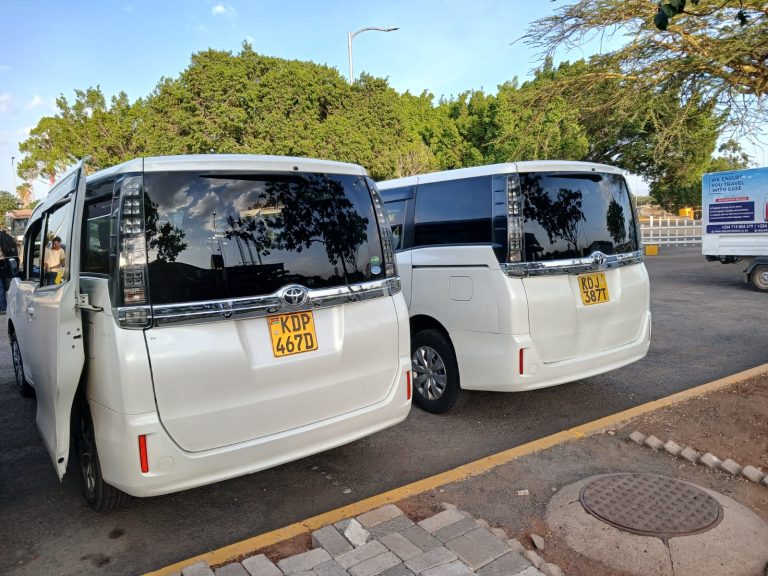 Nairobi airport transfer vans parked at JKIA for passenger pickup